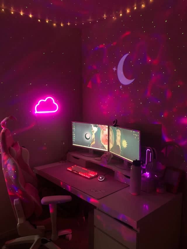 galaxy themed pink girl gaming room setup
