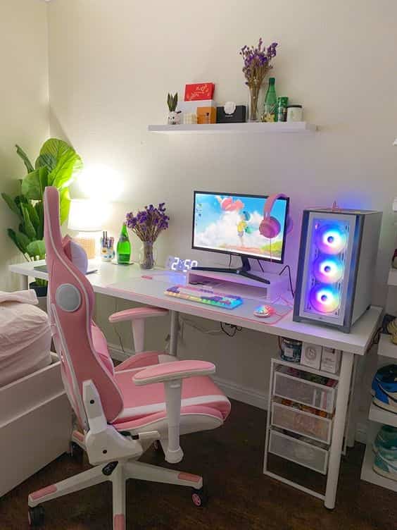 pink white gaming desk setup on bedroom