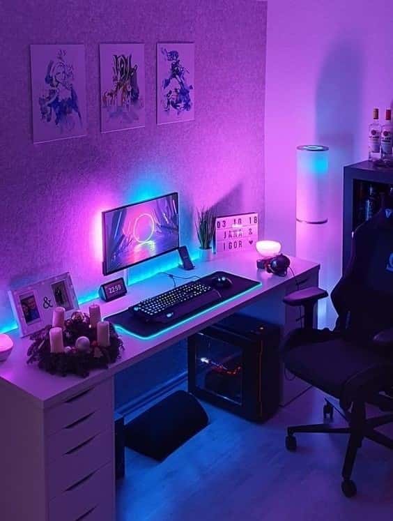 purple themed desk setup with wall mounted monitor