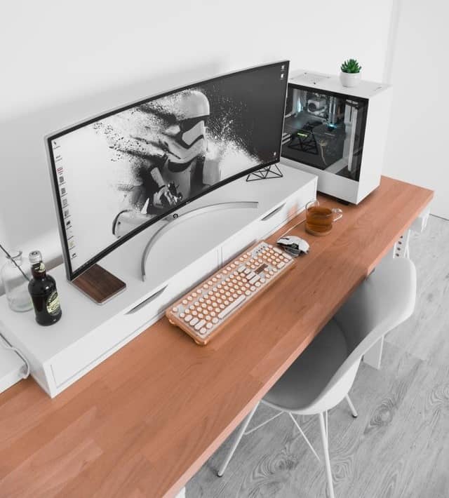 white battlastion setup on a wooden desk