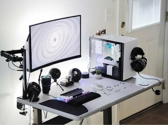 white gaming setup with black accessories